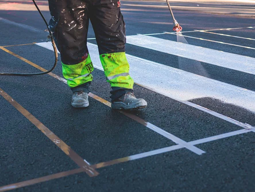Spraying Paint Markings in Asphalt Pavement