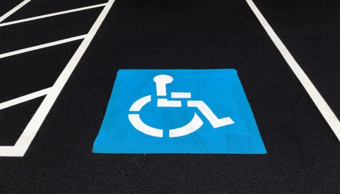 ADA compliant line striping and pavement markings of accessible parking space